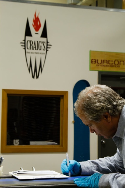 Jake Signing Stone Hut Boards-Lowres